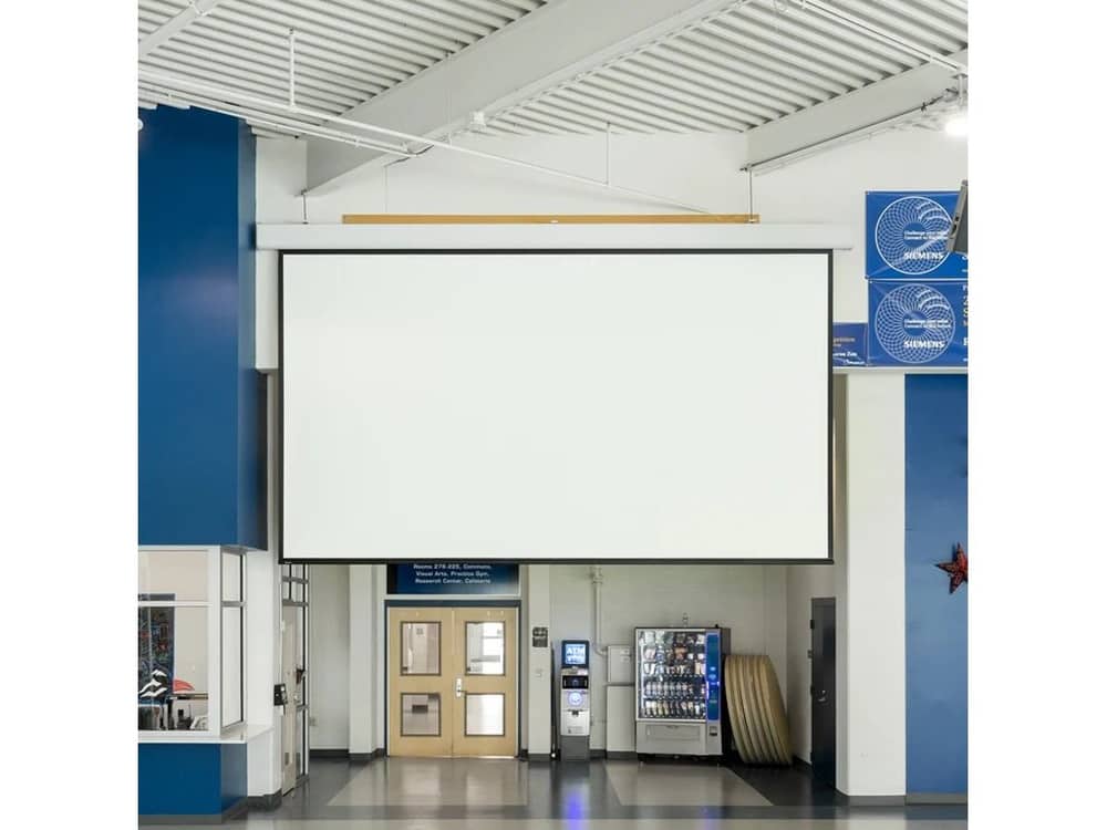 Draper Acumen XL E projection screen installed in a corridor